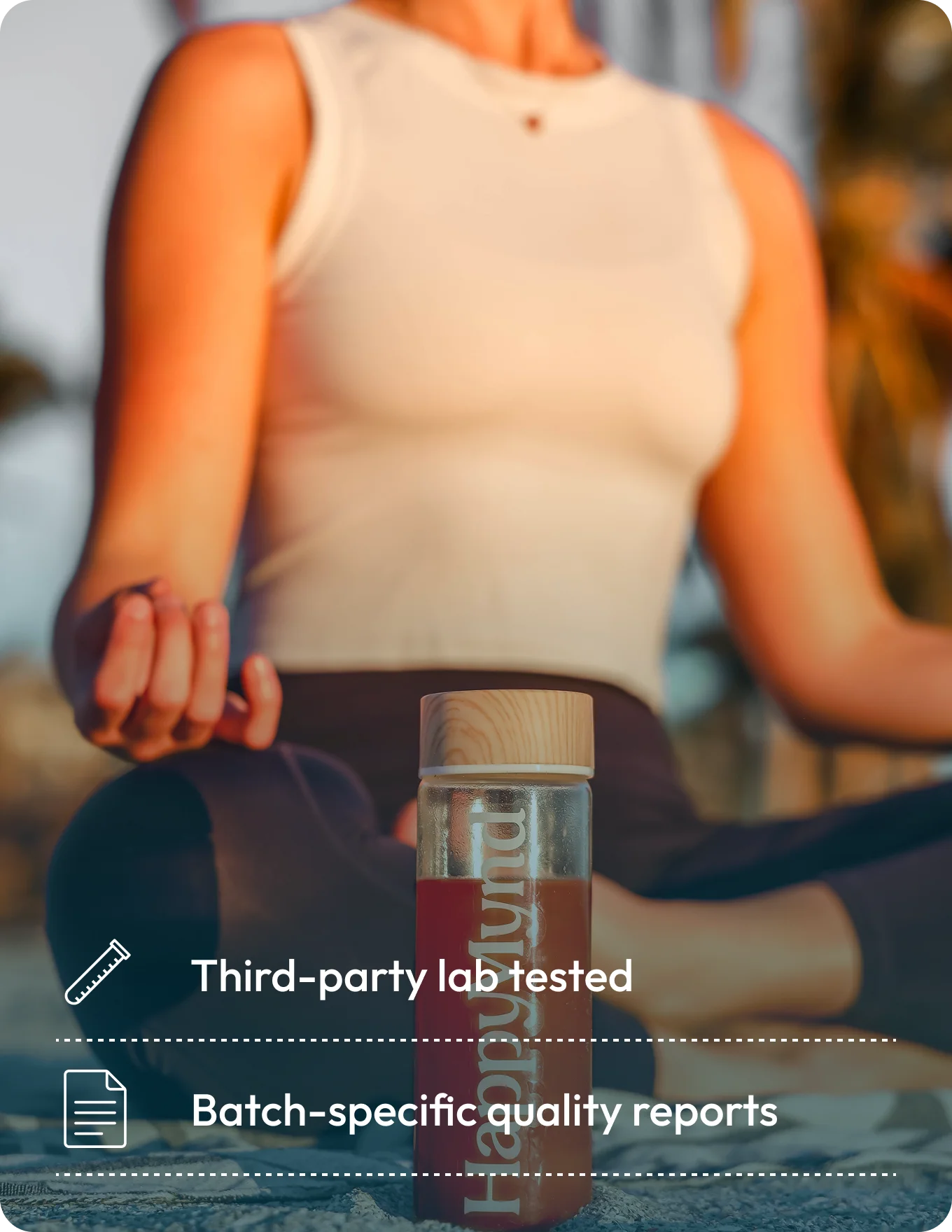 Person holding a bottle with text about third-party lab testing and batch-specific quality reports.